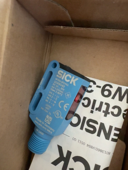 The SICK WTB9-3P2461 is a compact background suppression photoelectric sensor from the W9 series, with order number 1049049. Featuring background suppression capability, it reliably distinguishes objects from backgrounds and is suitable for harsh industrial environments.