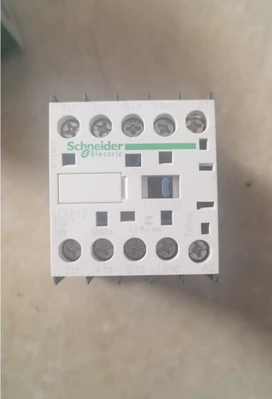 This is a Schneider TeSys K series 3-pole miniature AC contactor. It has a rated operational current of 12A (AC-3, 440V), coil voltage of 110V AC, and is fitted with 1 Normally Open (1NO) auxiliary contact